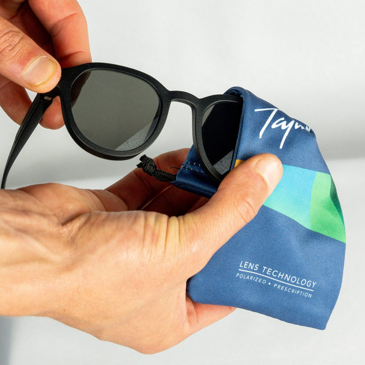 Using Tajima microfiber storage pouch to clean sunglass lenses