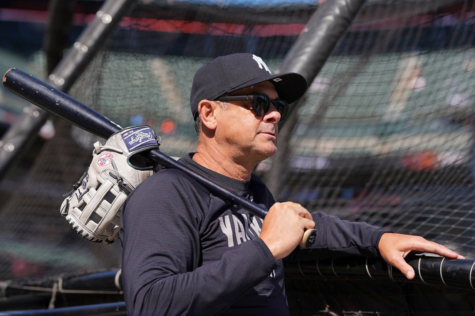 Aaron Boone in basn5 Highway 1 sunglasses with Gray 15 polarized lenses, bat and glove over his shoulder in bright conditions