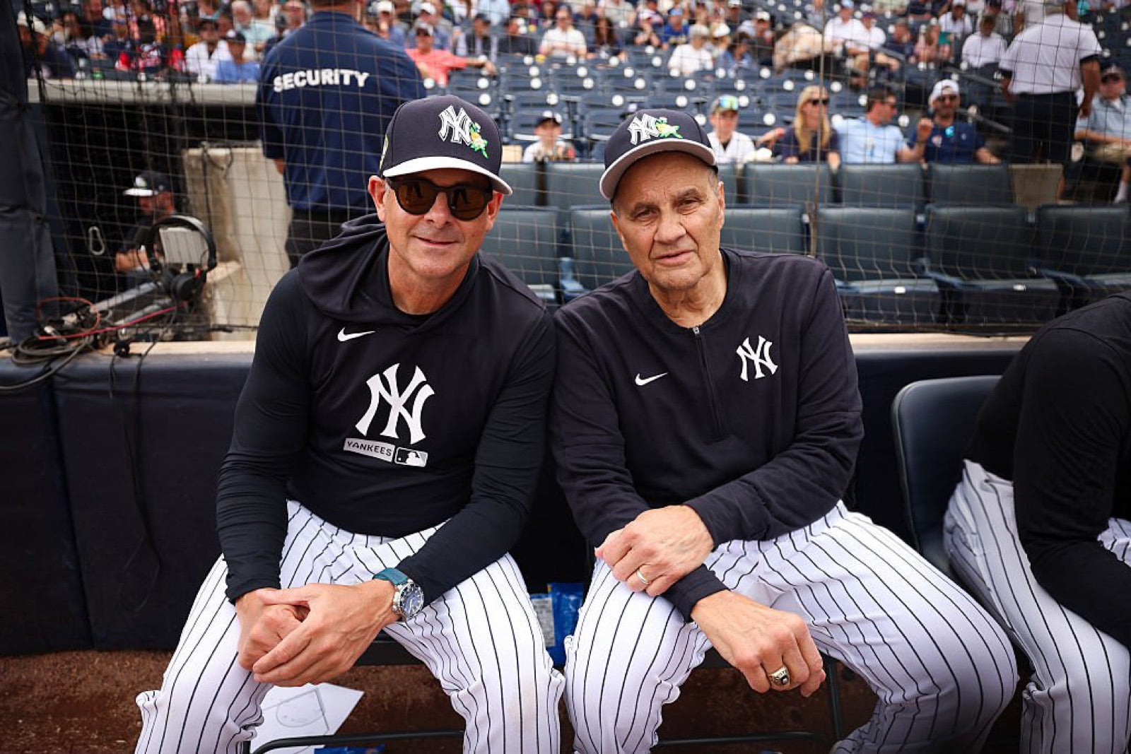 Aaron Boone wearing basn5 Highway 1 sunglasses in Brown 15 Gold Mirror seated next to Joe Torre at Yankees spring training