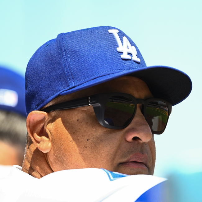 Close-up of Dave Roberts in basn5 Davenport sunglasses with the field reflected in the lenses