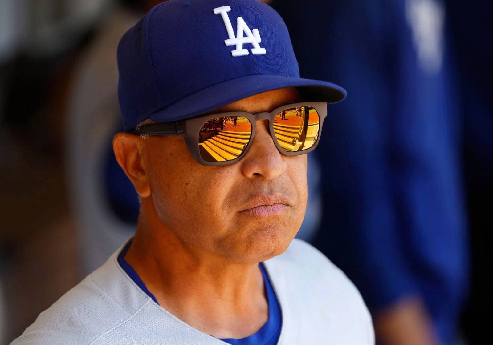 Close-up of Dave Roberts in the basn5 Davenport with gold mirror Tajima Rx polarized lenses, stadium reflected in the lenses
