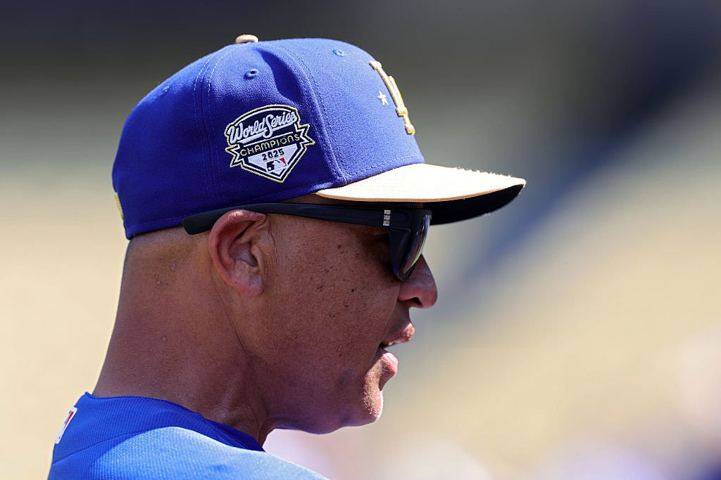Dave Roberts in profile wearing basn5 Davenport sunglasses, gold-trim 2025 World Series Champions cap, Opening Day 2026 at Dodger Stadium