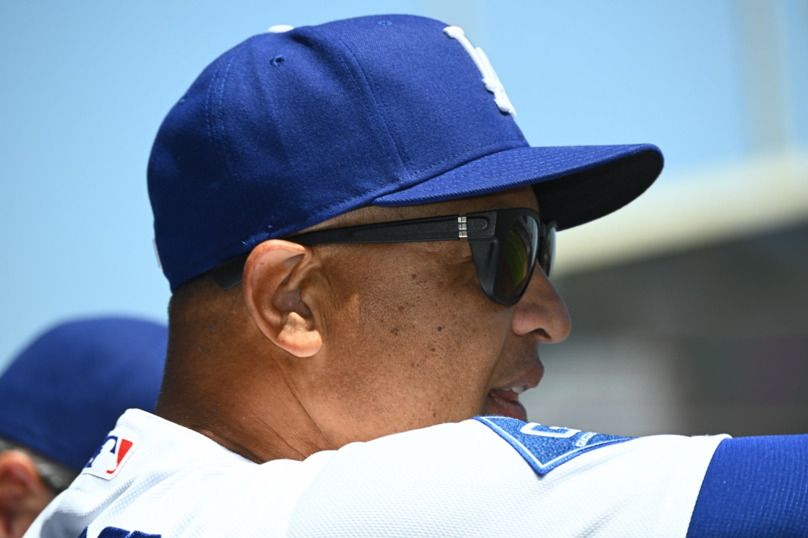 Side profile of Dave Roberts wearing basn5 Davenport sunglasses at Dodger Stadium